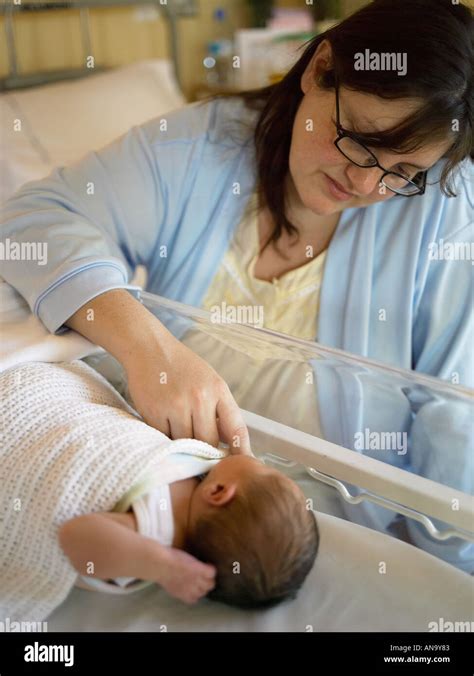 Young Mother Touching Her Newborn Baby Stock Photo Alamy