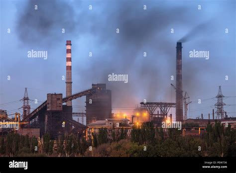 Heavy industry air pollution image. Metallurgical plant smoke chimney Stock Photo - Alamy