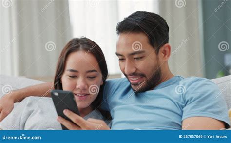 Young Happy And Asian Couple Taking A Selfie Together At Home Chinese