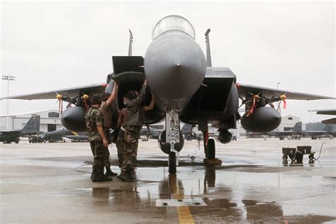 Ground Crew Members Perform A Preflight Check On An F E Eagle