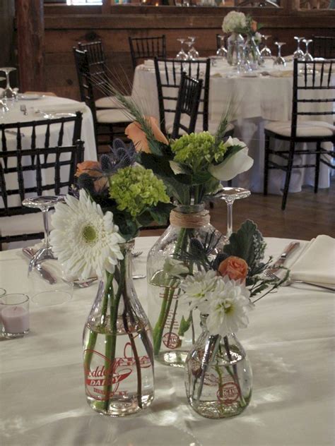 30 Incredible Milk Bottle Centerpieces For Your Wedding Party Milk Bottle Centerpiece Bottle