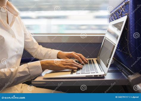 Close Up Woman Hands Typing On A Laptop Keyboard In The Train Royalty