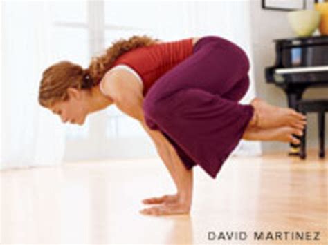 A Woman Is Bending Over On The Floor In Front Of A Piano