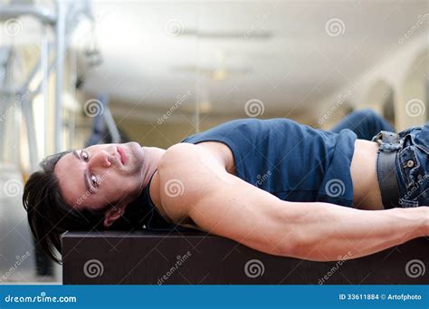 Laying Handsome Adult Man Looking At Camera Stock Photo Cartoondealer