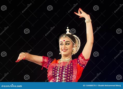 Female Classical Odissi Dancer Performing Odissi Dance On Stage At