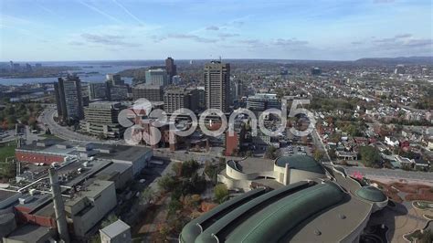 Aerial view of city raise reveal suburbs and blue sky Stock Footage,# ...