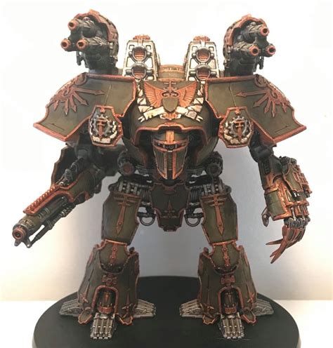 A Warhammer Is Standing On Top Of A Black Base With Gold Paint And