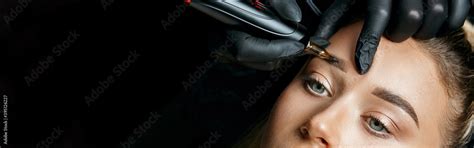 Tattoo Artist Doing Permanent Makeup Stock Photo Adobe Stock