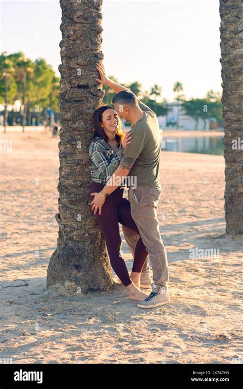 A Couple In Love Hugs On The Sea Beach A Man And A Woman Enjoy Each