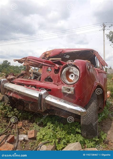 Old Broken Red Car Crashed And Abandoned Car After An Accident Stock