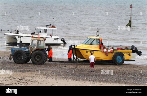 Fishing boats landing on the beach at Hornsea, east Yorkshire, UK Stock ...