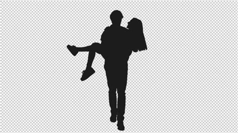 Silhouette Of Young Man Carrying His Girlfriend In Arms By Mgpremier