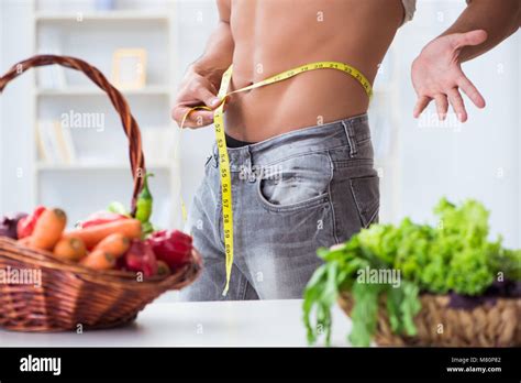 Young Man In Healthy Eating And Dieting Concept Stock Photo Alamy