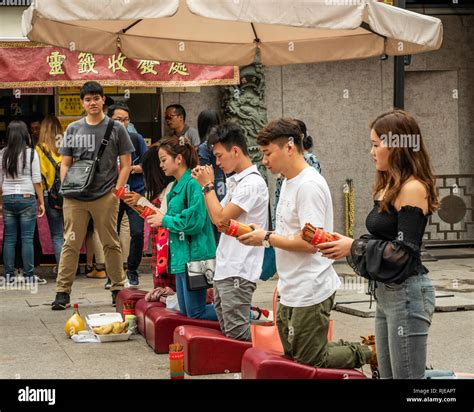 Worshipers At The Wong Tai Sin Temple Complex In Kowloon Hong Kong