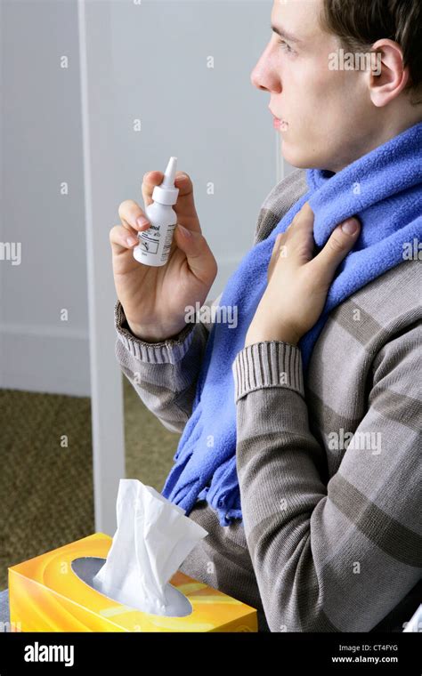 Man Using Nose Spray Stock Photo Alamy