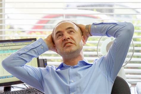 Businessman At His Desk Throws Documents And Papers Into The Air Stock