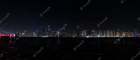 Premium Photo | Beautiful night view of dubai skyscrapers from the sea ...