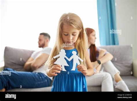 Adorable Caucasian Child Girl Hold Drawing Of Parents Separated They