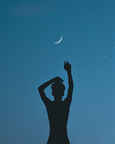 Silhouette of Person Raising his Hands · Free Stock Photo