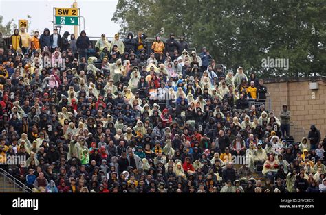 Wolverhampton Wanderers fans brave the rain in an open stand during the ...