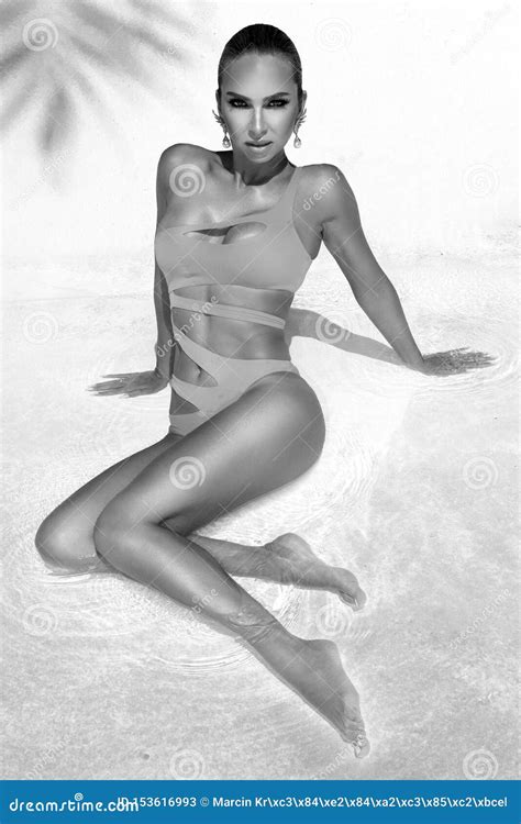 Elegant Woman In The Amazing Bikini On The Sun Tanned Slim And Shapely
