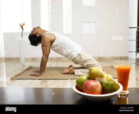 Man in a Yoga pose Stock Photo - Alamy