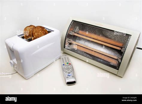 Household items using infrared radiation. These are a toaster, a remote control and an electric ...