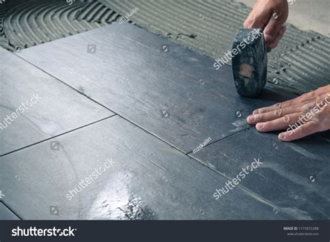 Worker Placing Ceramic Floor Tiles On Stock Photo 1115972288 Shutterstock