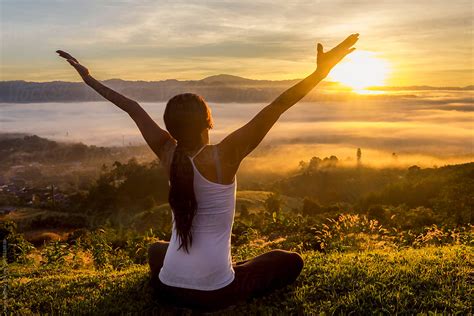 Peaceful Woman Meditating On A Mountain At Sunrise By Soren Egeberg