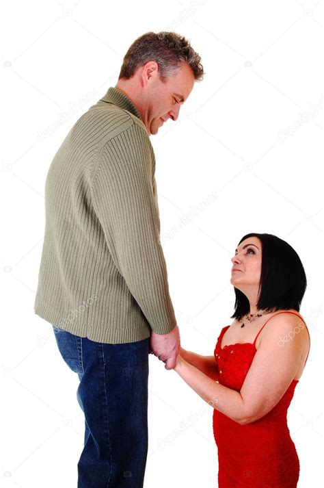 A Woman Is Kneeling For The Man Stock Photo Sucher