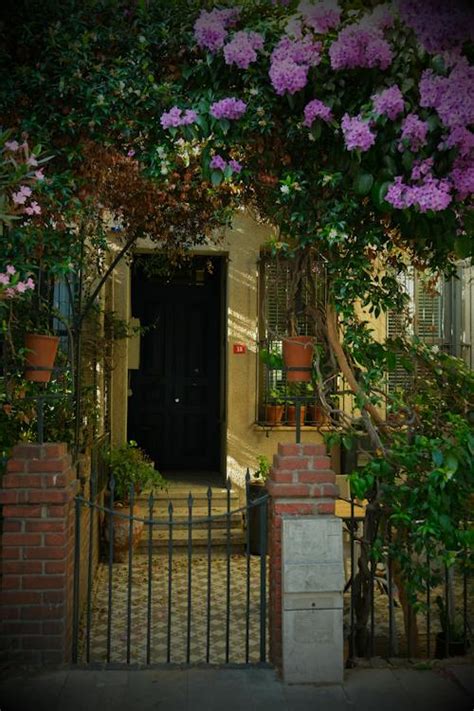 Entrance to a House with Flowering Shrubs in the Front · Free Stock Photo