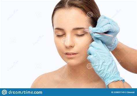 Makeup Artist Combs And Plucks Eyebrows After Dyeing In A Beauty Salon