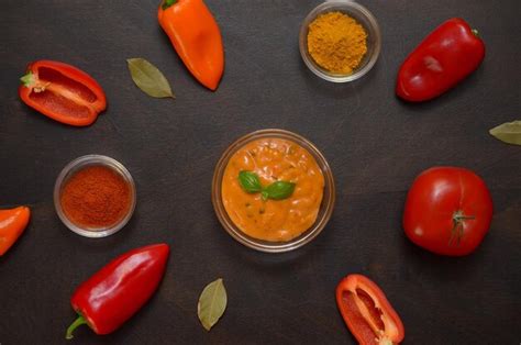 Premium Photo Sauces Spices And Vegetables On The Kitchen Table