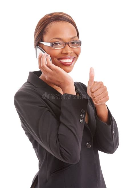 Im On Top Of Things A Confident Ethnic Corporate Woman On Her Cell Phone Giving The Thumbs Up