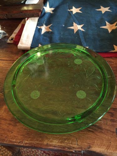 1930 S URANIUM GREEN GLASS FOOTED CAKE PLATE SUNFLOWERS JEANETTE