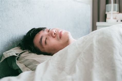 Premium Photo Sick Asian Male Sleeps On The Bed Patient Man Resting