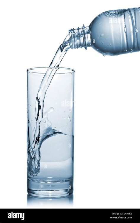 Water Pouring Into Glass From Bottle Isolated On White Stock Photo Alamy