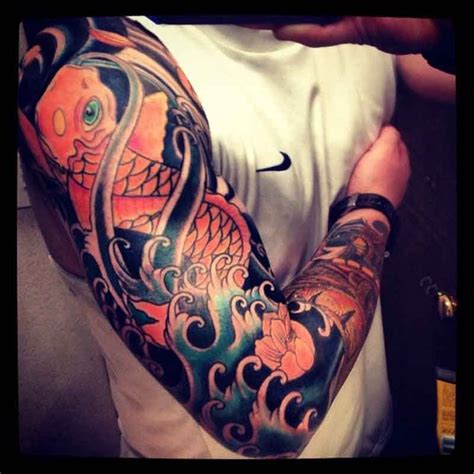 Great Colorful Koi Fish Tattoo On Whole Arm Tattoos Tattoo Designs