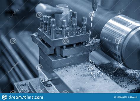 The Operation Of Lathe Machine Cutting The Steel Shaft Stock Image