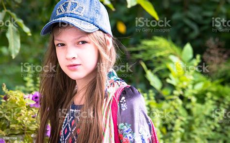 Portrait Of A Smiling Girl Lying Stock Photo Download Image Now