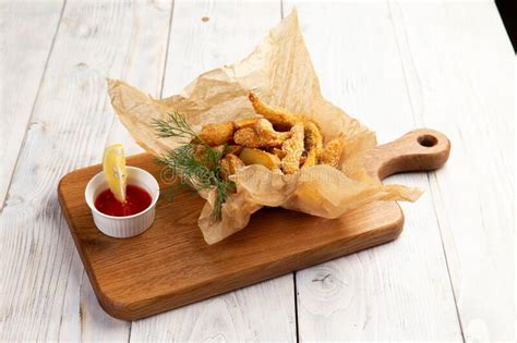 Traditional Appetizer Fish And Chips On A Light Background Stock Image