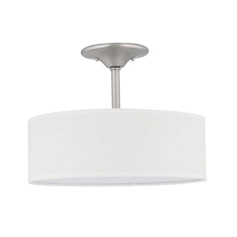 A Light Fixture With A White Drum Shade