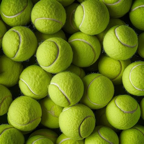 Premium Photo A Pile Of Tennis Balls With A White Stripe On The Bottom