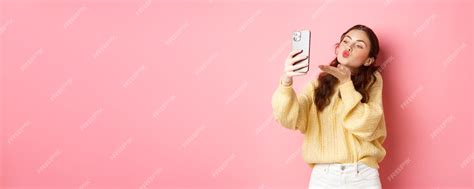 Premium Photo Beautiful Flirty Girl Taking Selfie On Smartphone