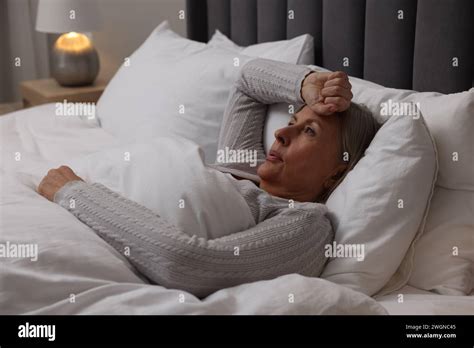 Menopause Night Sweat Woman Suffering From Hot Flash In Bed Stock Photo Alamy