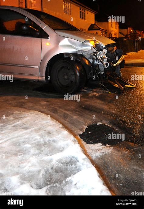 A car accident involving black ice at night Stock Photo - Alamy