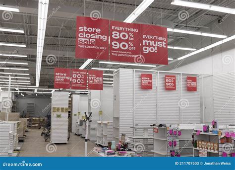 Store Closing And Huge Discount Signs Displayed At A Soon To Be Out Of