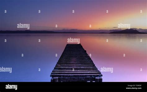 Jetty During Sunrise At Lake Rotorua New Zealand Stock Photo Alamy