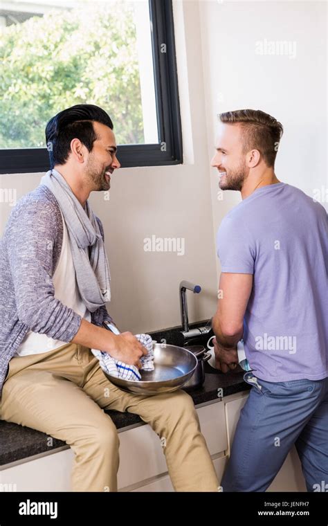 Smiling Gay Couple Washing Dishes Stock Photo Alamy