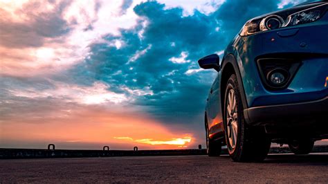 Sports Car At Sunset Backiee